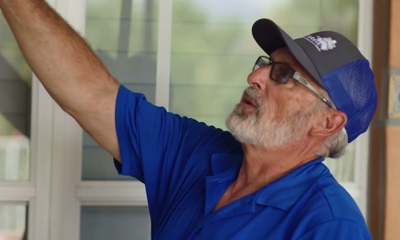 man pointing at a wall