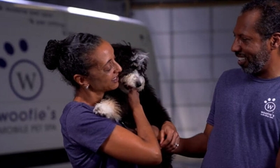 Woofie's franchise owners with a cute dog