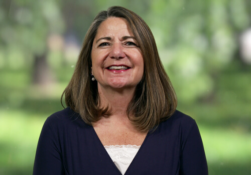 A person smiling for the camera
Description automatically generated with low confidence